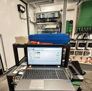 Electrical controls cabinet and diagnostic laptop in supplied FRN material